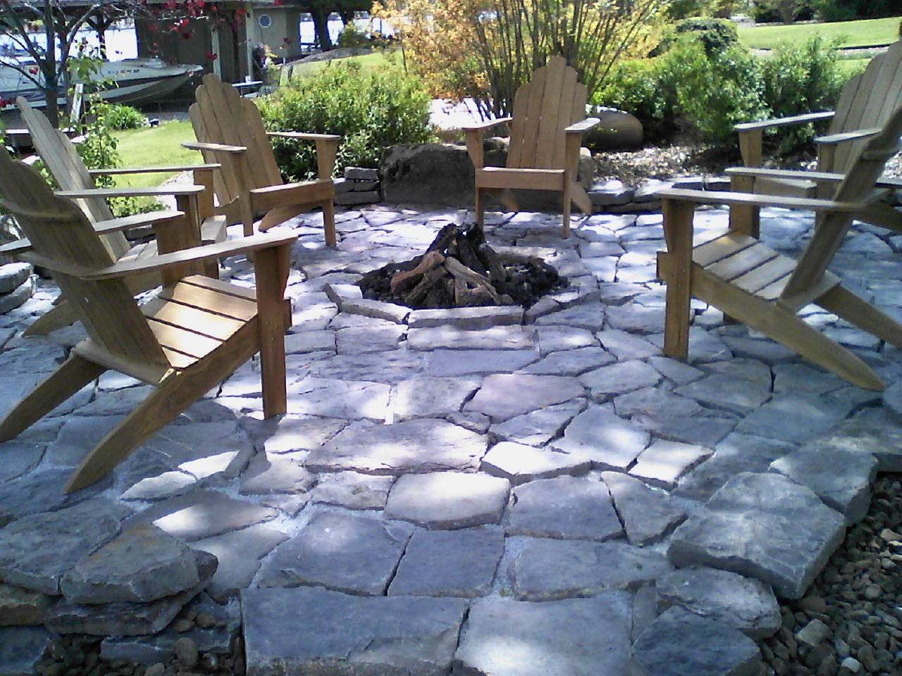 native stone patio and firepit fueled by propane, landscaping services
