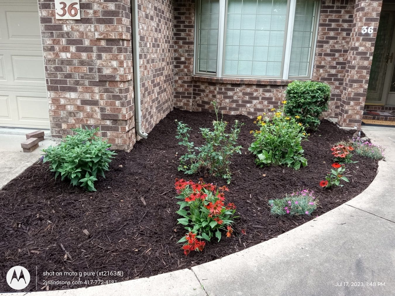 Round corner garden planted flower beds